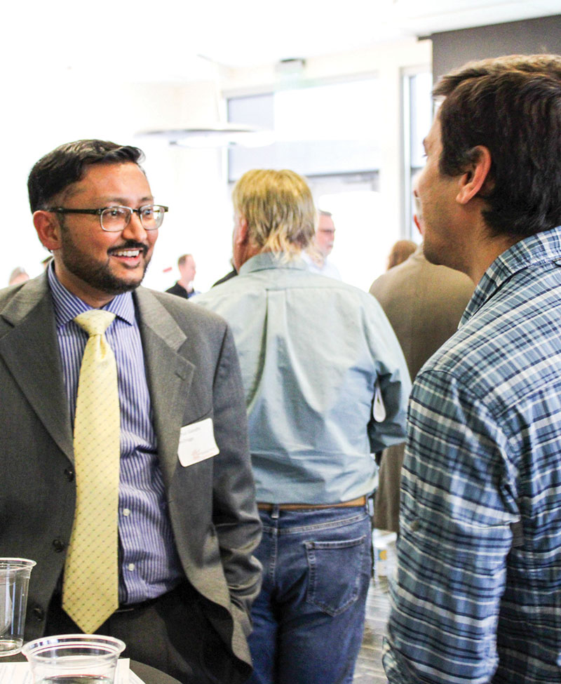 Men talking at social event