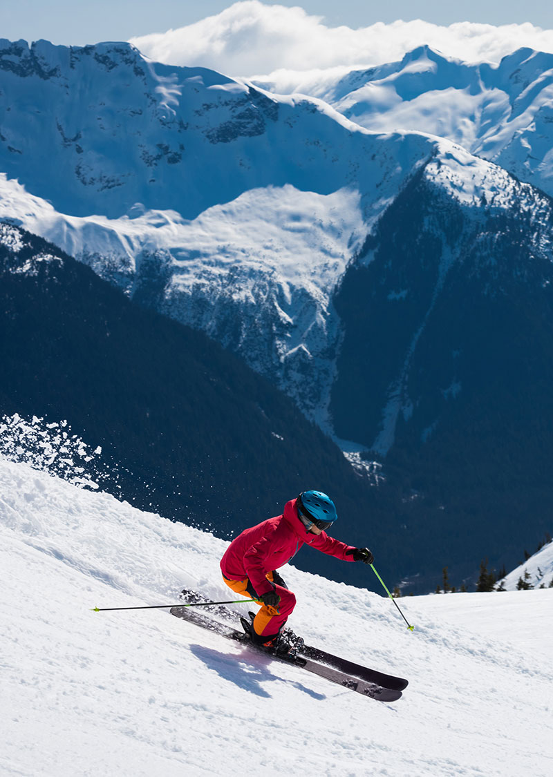 Female athlete skiing in the mountains